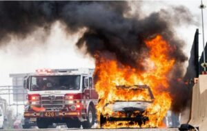 Plug-In Hybrid Electric Vehicle Catches Fire in Douglas County Garage Injuring Delivery Driver