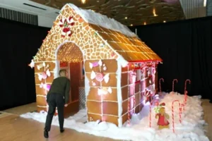 SWEET TRADITION: Gaylord Rockies Resort’s pastry team is building a 12-foot gingerbread cabin for the holidays