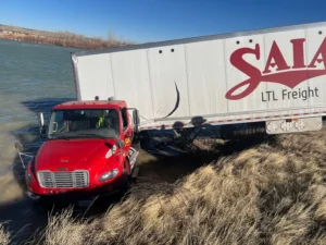 High winds blow semitrailer off road into Little Soda Lake