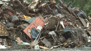 Crews removing massive piles of debris from Waialua flood damage