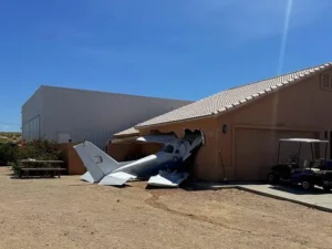 Small plane crashes into house near airport runway in small town south of Las Vegas