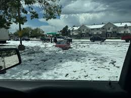 Woman rescued after driving into flood hidden by hail in Aurora
