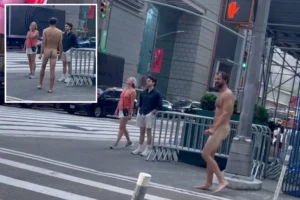 NUDE YORK, NUDE YORK — EXCLUSIVE: Buck-naked bum who’s not the Naked Cowboy strolls through Times Square, drawing gasps