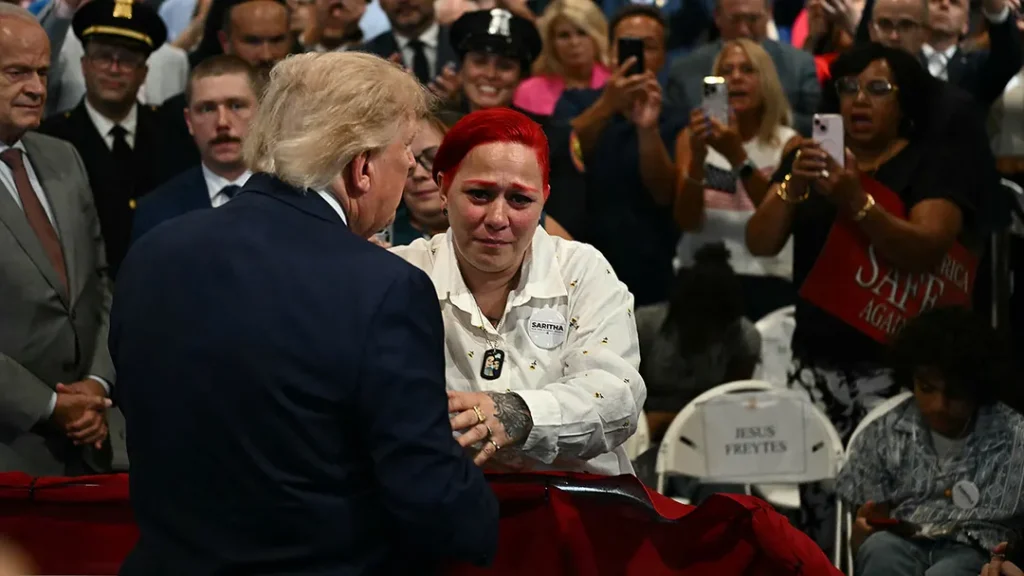 POWERFUL EMBRACE: Trump, in impromptu moment, left stage during his speech to comfort grieving parents