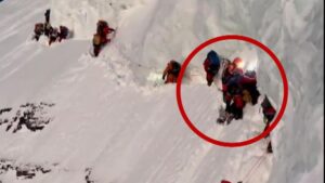 LEFT TO DIE AT 27,000 FEET: Never-before-seen footage shows climbers discover dying mountain guide hanging upside-down during record-breaking K2 climb, and decide they have to leave him there